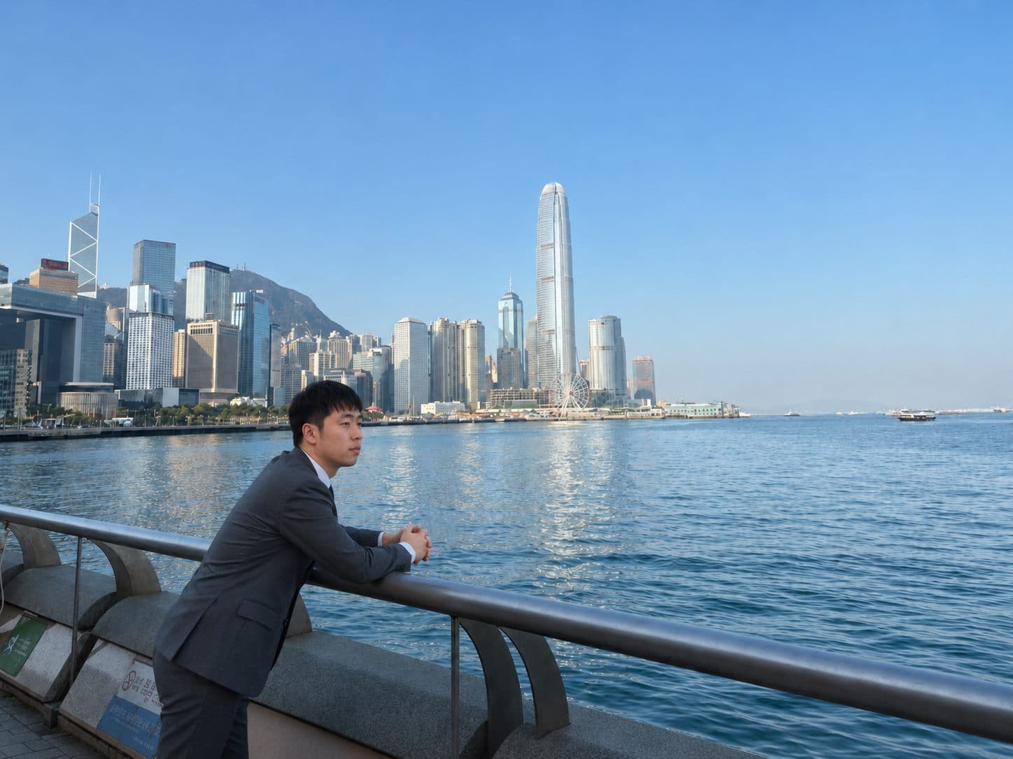 Jesse in Hong Kong with a global city skyline